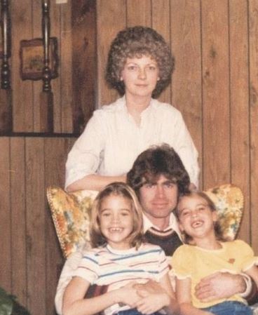 An old picture of Joni with her husband and two daughters